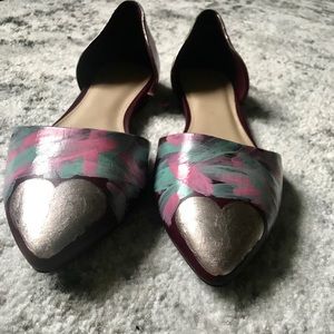 Hand-painted flats. Pointed toes.